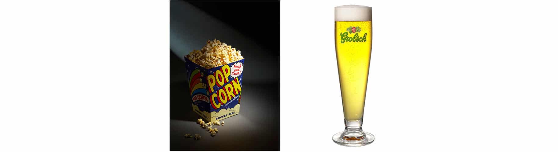 a tub of popcorn and a tall glass of beer