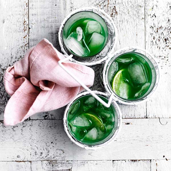 three glasses of iced green lemon drinks